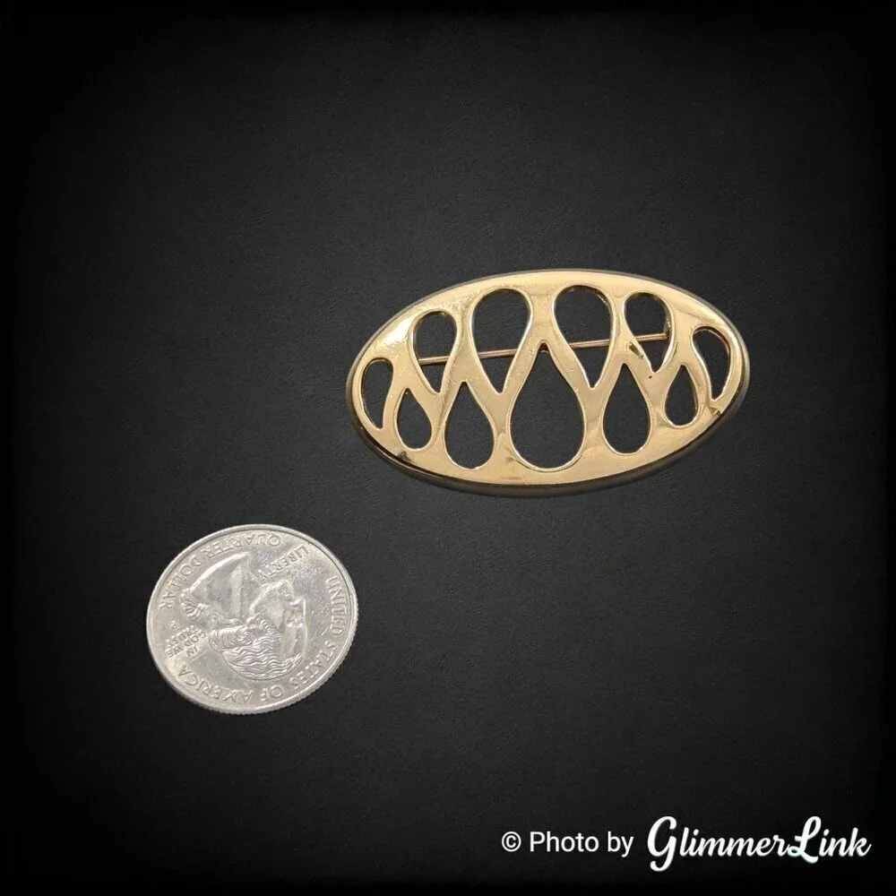 Vintage Monet Openwork Oval Shaped Teardrop Cut Out Gold Tone Brooch